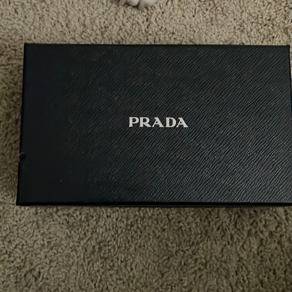 Prada wallet for sale. Slightly used logo but in great condition almost … real!